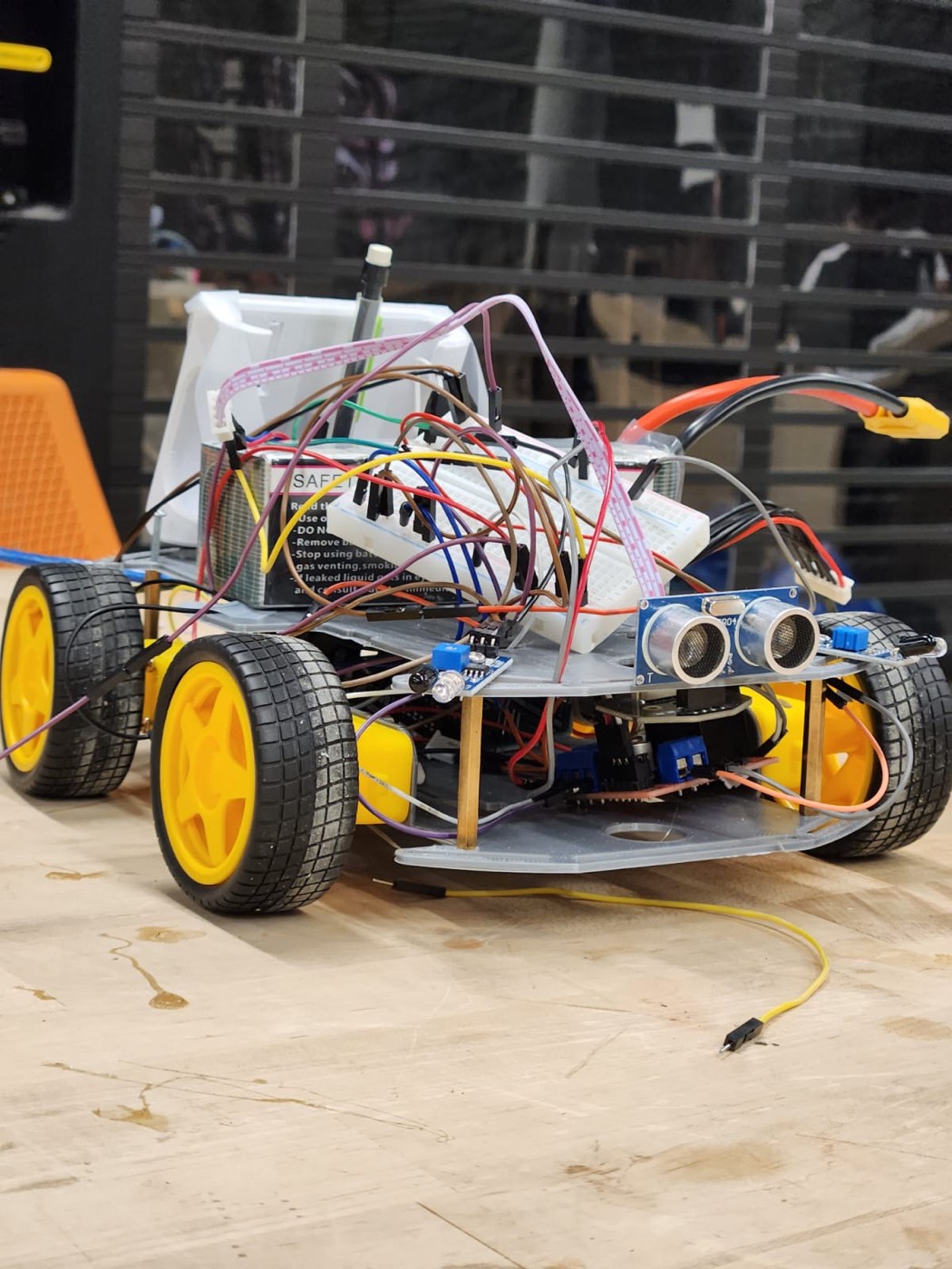 The 3D-printed autonomous rover — Arduino, ultrasonic distance sensor, and motor drivers wired onto the chassis